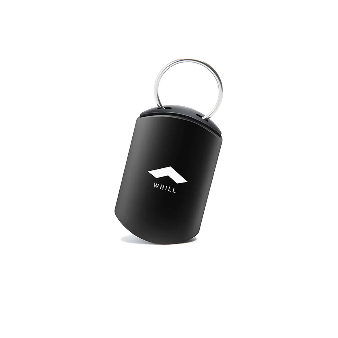 A compact black Smart Key for WHILL C, F, and R models with a silver key ring and white WHILL logo on the front, designed for your power chair. Displayed against a plain white background.